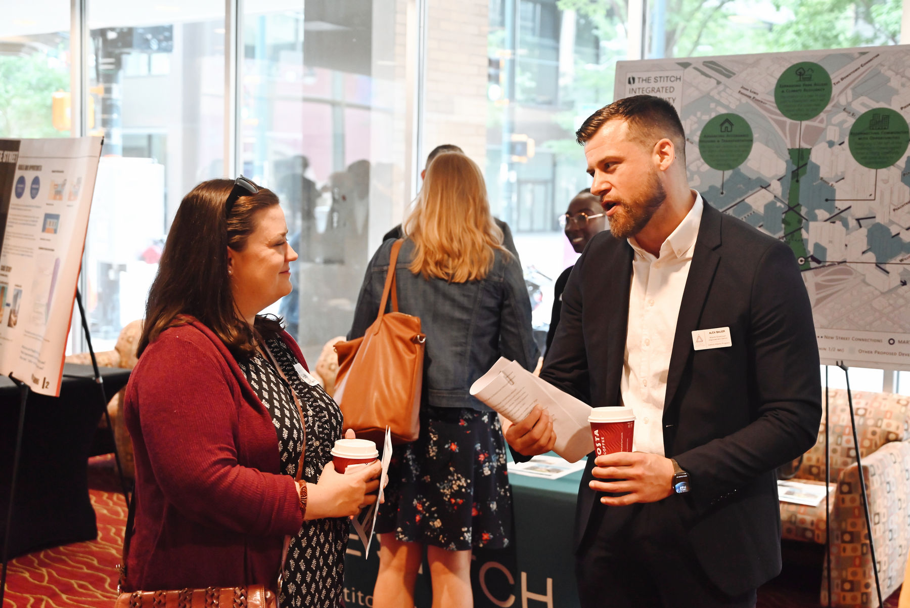 People talking in front of exhibits